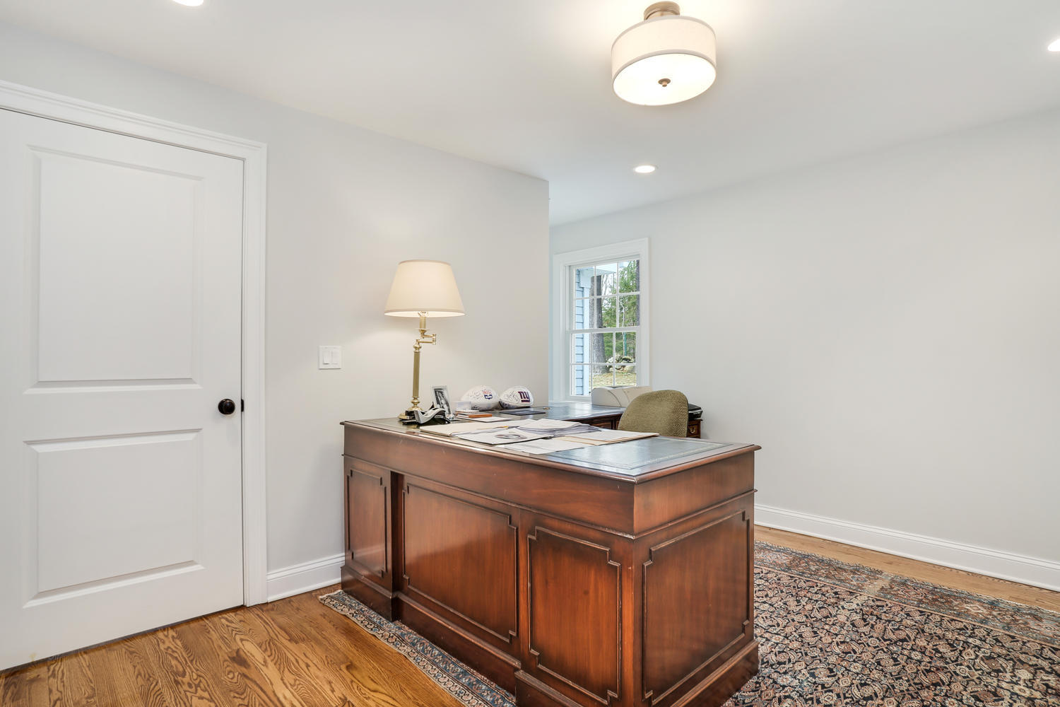 278 Davenport Ridge Road New Canaan, CT 06840 - Photo 15 of 31 a kitchen with a stove and a table