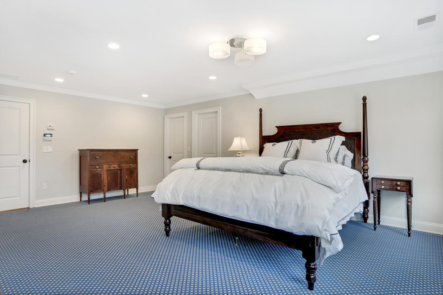 278 Davenport Ridge Road New Canaan, CT 06840 - Photo 17 of 31 a spacious bedroom with a bed window and table