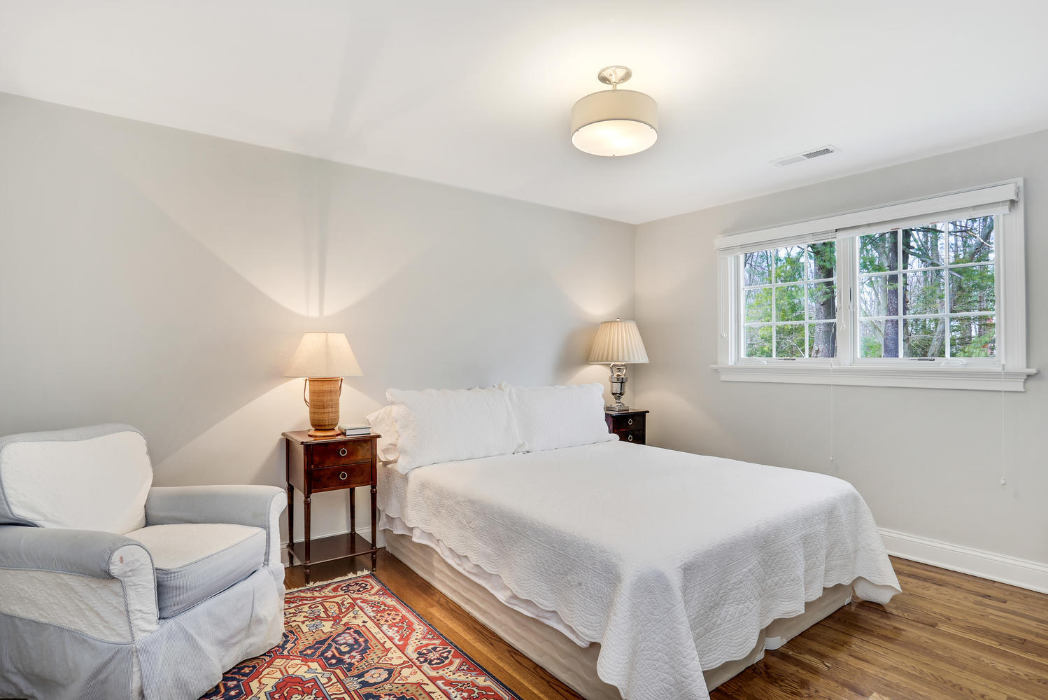 278 Davenport Ridge Road New Canaan, CT 06840 - Photo 24 of 31 a bedroom with a bed and a lamp