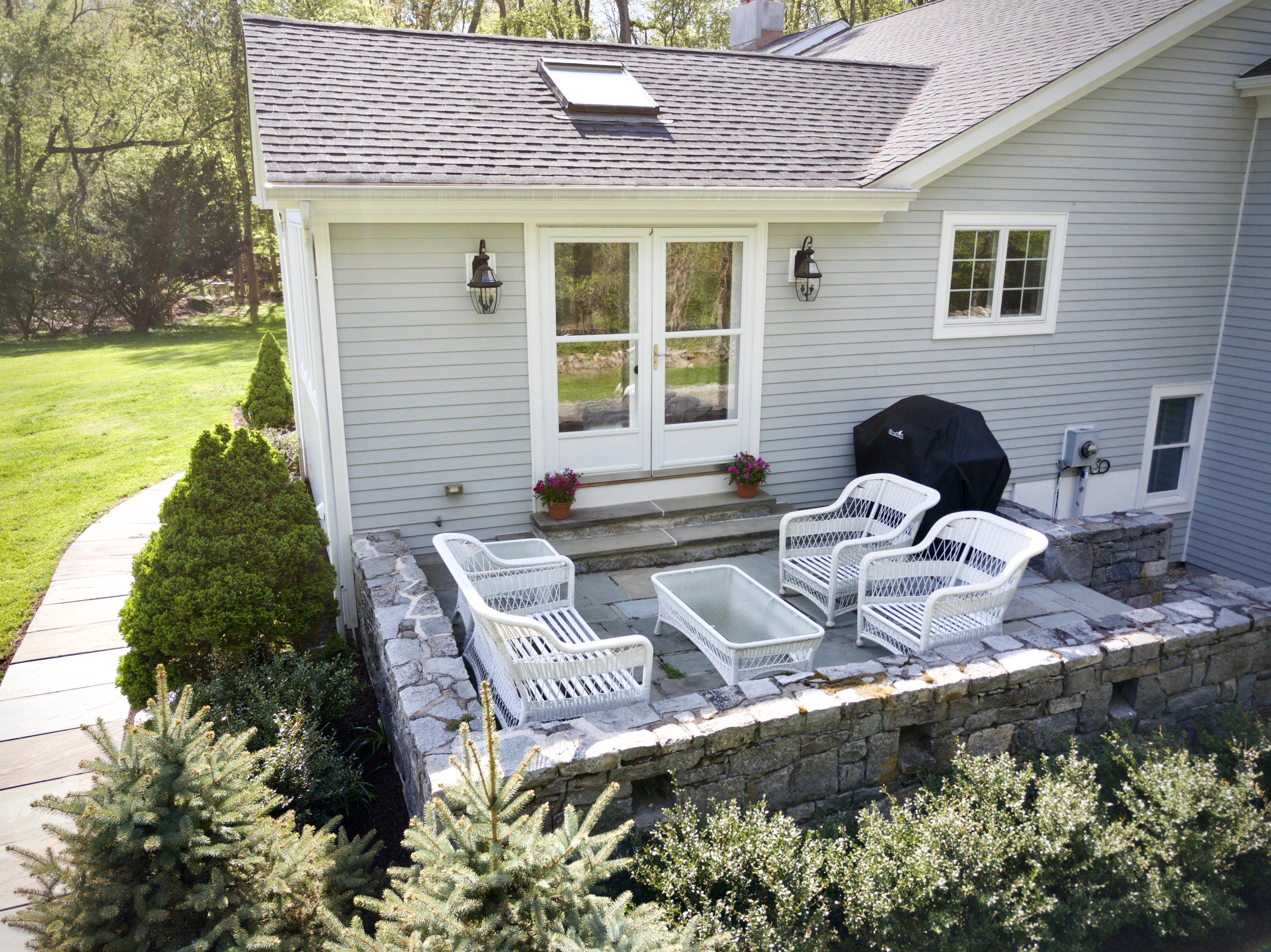 278 Davenport Ridge Road New Canaan, CT 06840 - Photo 25 of 31 a couple of table and chairs in the patio
