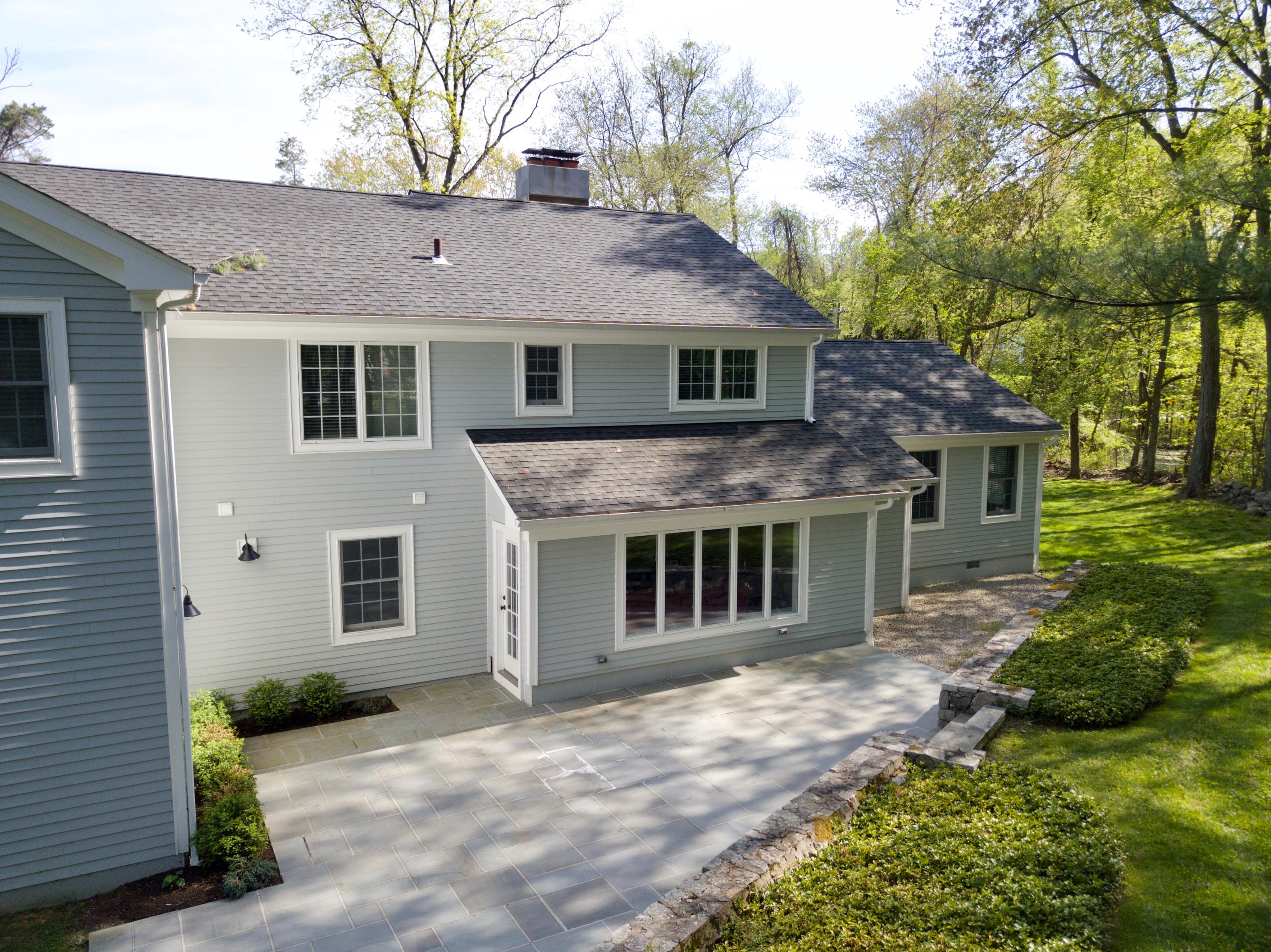 278 Davenport Ridge Road New Canaan, CT 06840 - Photo 26 of 31 a aerial view of a house with a yard and potted plants