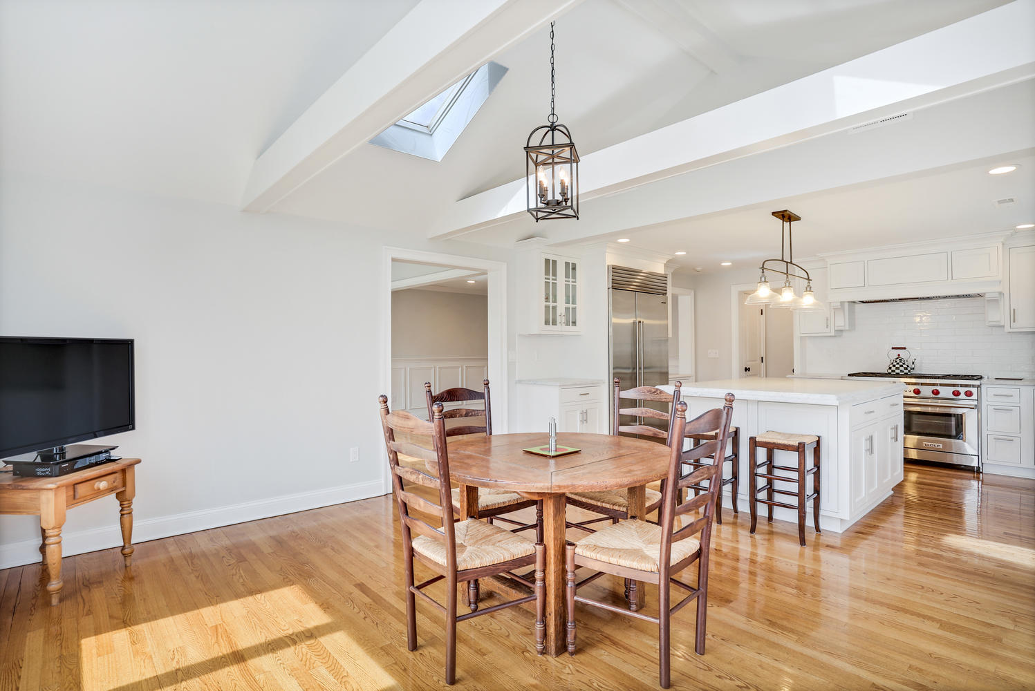 278 Davenport Ridge Road New Canaan, CT 06840 - Photo 9 of 31 a view of a dining room with furniture and wooden floor