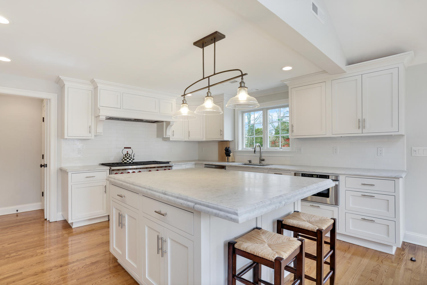 278 Davenport Ridge Road New Canaan, CT 06840 - Photo 10 of 31 a kitchen with a stove a sink and a refrigerator