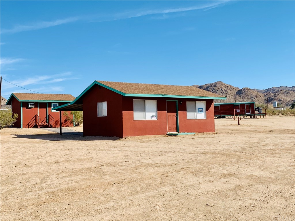 51275 Bell Road Johnson Valley, CA 92285 - Photo 1 of 1 a front view of a house with a yard