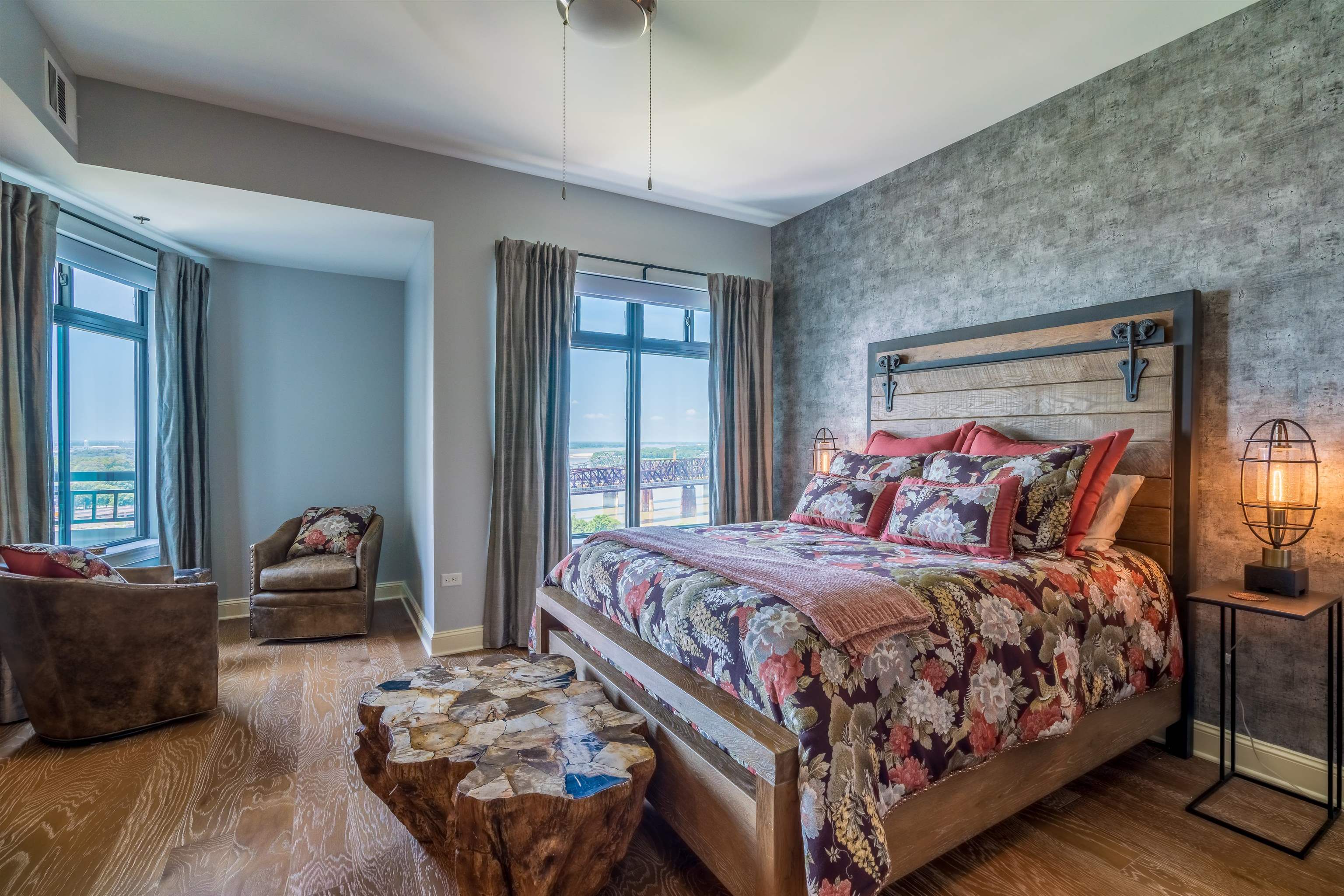 717 Riverside Drive, Unit PH2 Memphis, TN 38103 - Photo 20 of 25 a bedroom with a bed and wooden floor