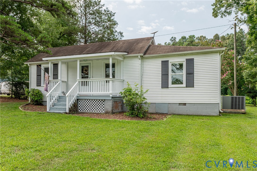 661 CCC Road Crewe, VA 23930 - Photo 38 of 38 White siding exterior with dark shutters, covered