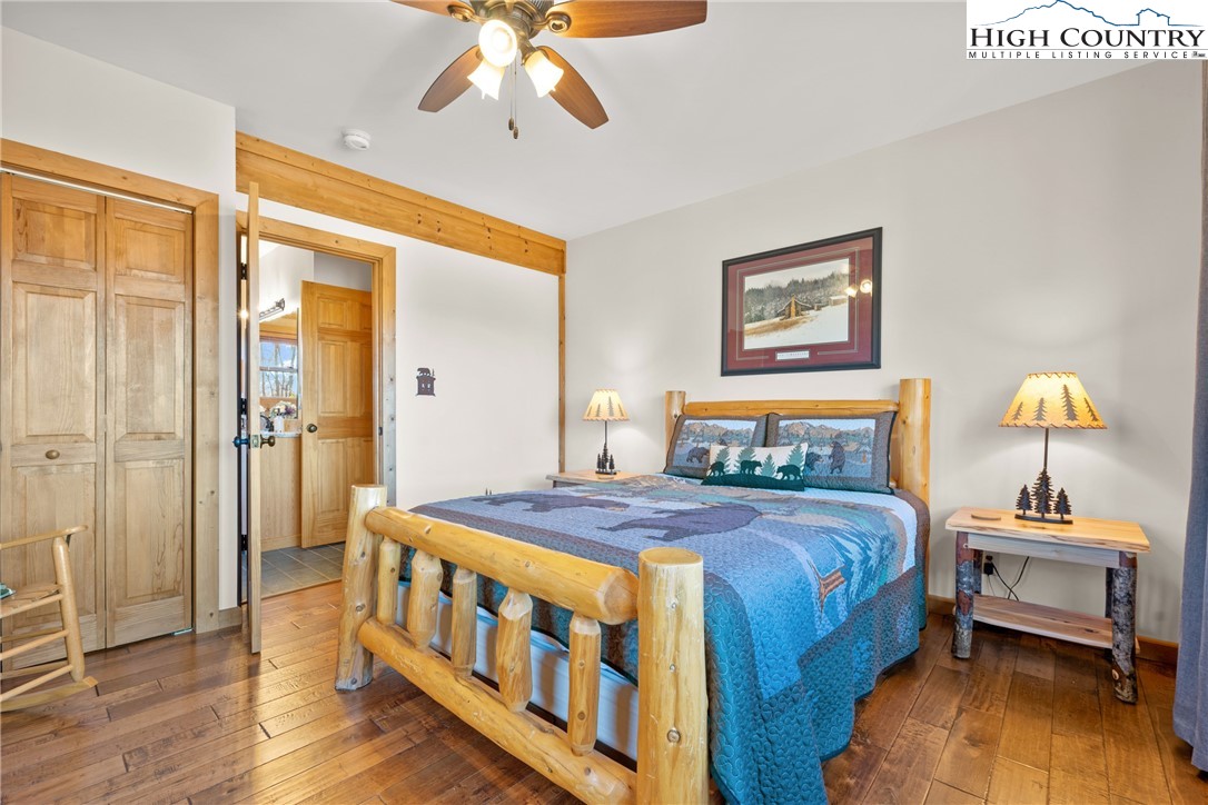 713 River Ridge Road Boone, NC 28607 - Photo 15 of 44 a bedroom with bed and wooden floor