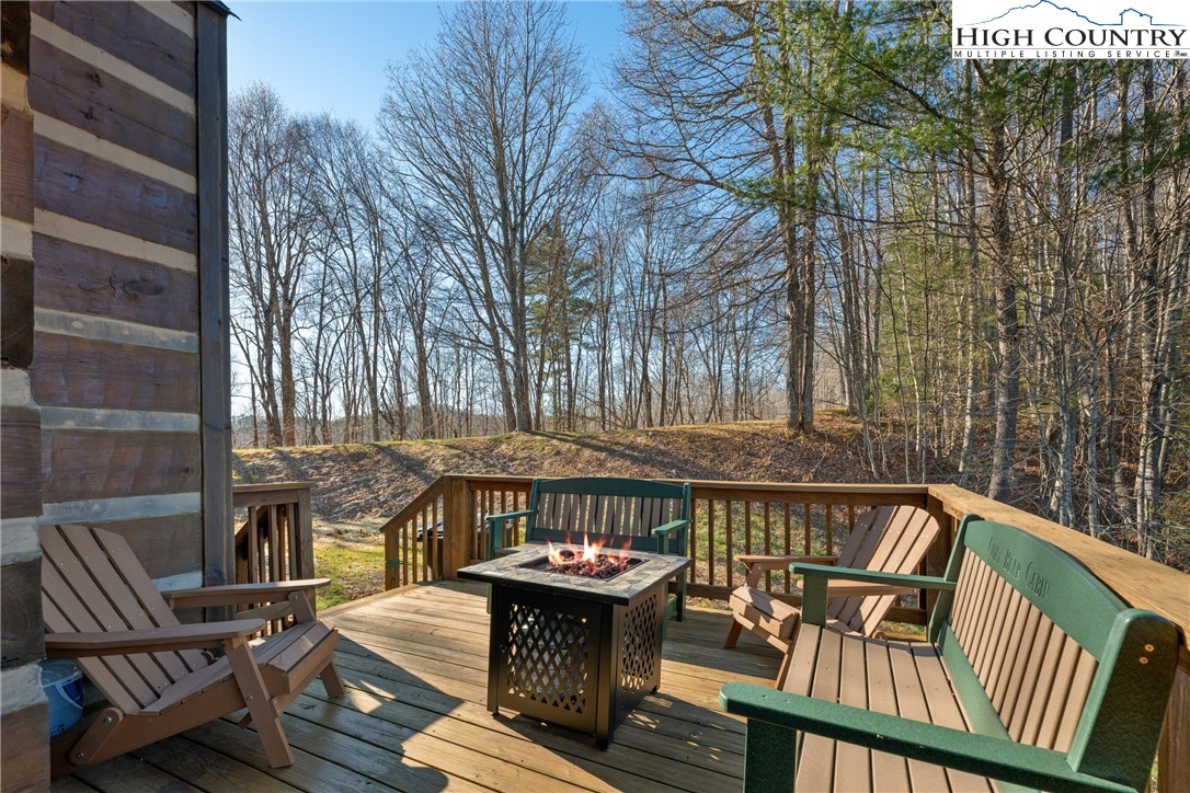 713 River Ridge Road Boone, NC 28607 - Photo 20 of 44 a view of a chairs and table on the deck