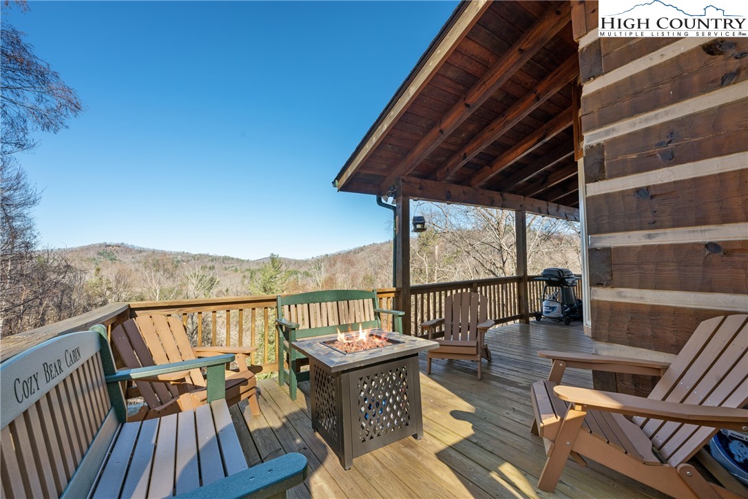 713 River Ridge Road Boone, NC 28607 - Photo 2 of 44 a view of balcony with furniture and outdoor seating