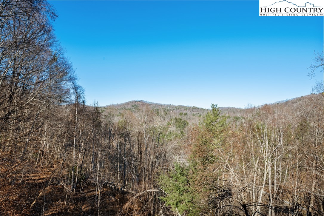 713 River Ridge Road Boone, NC 28607 - Photo 21 of 44 a view of a mountain range with trees in the background