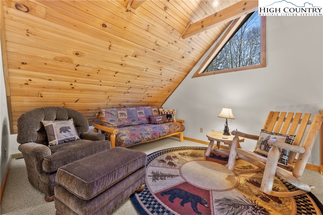 713 River Ridge Road Boone, NC 28607 - Photo 23 of 44 a living room with furniture and a wooden floor