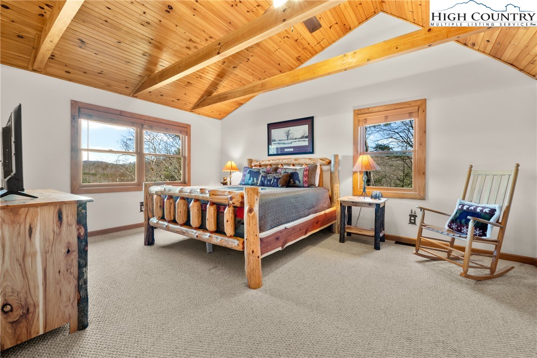 713 River Ridge Road Boone, NC 28607 - Photo 26 of 44 a bedroom with a bed and a window