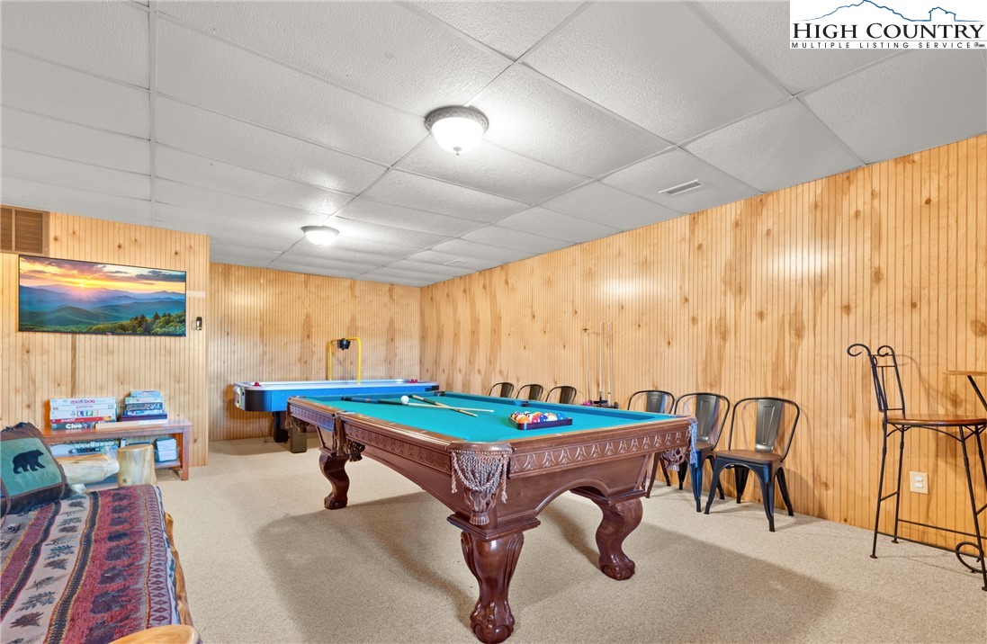 713 River Ridge Road Boone, NC 28607 - Photo 28 of 44 a dining room with furniture and a rug