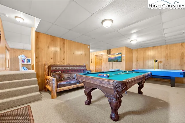 a room with furniture pool table