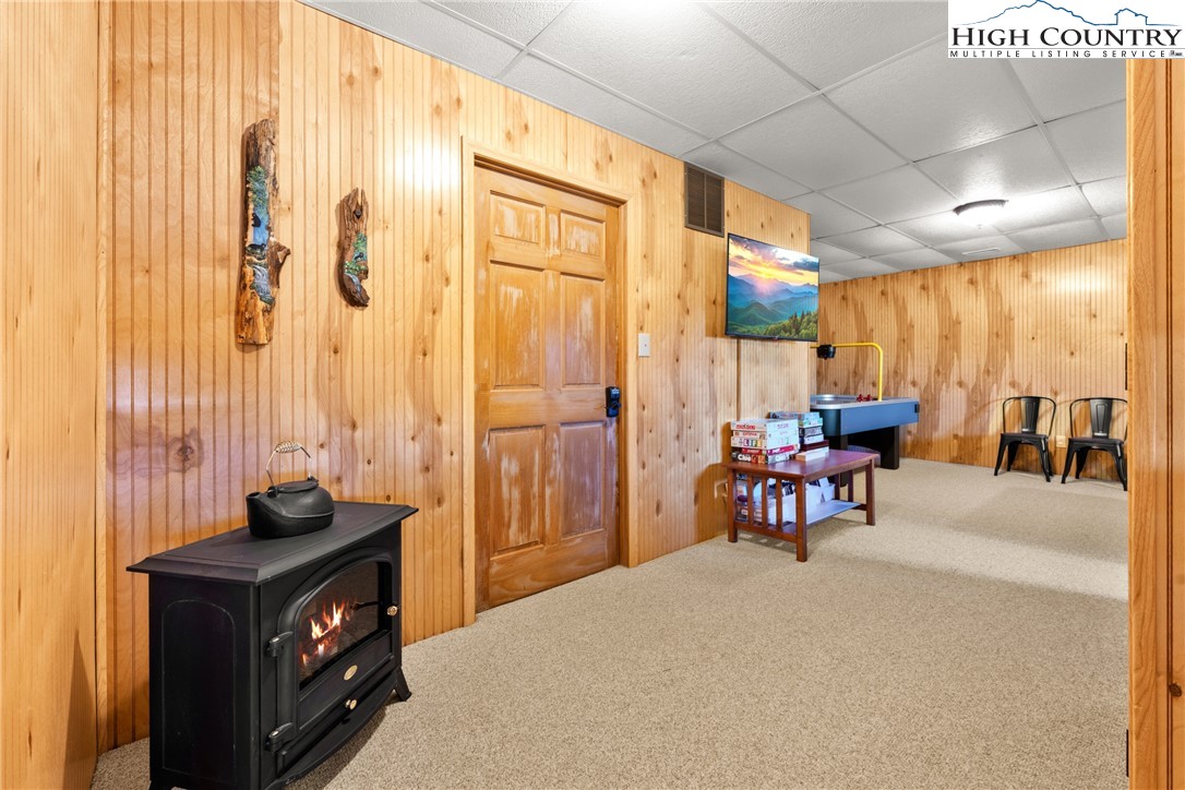 713 River Ridge Road Boone, NC 28607 - Photo 31 of 44 a kitchen with a table chairs and a stove