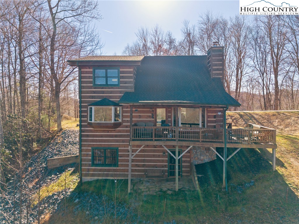 713 River Ridge Road Boone, NC 28607 - Photo 42 of 44 a view of a house with a yard chairs and iron fence