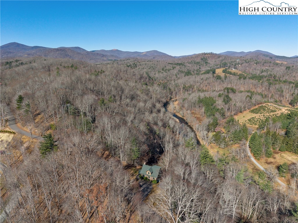 713 River Ridge Road Boone, NC 28607 - Photo 44 of 44 a view of a mountain range with trees in the background
