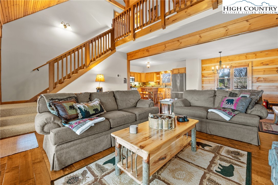 713 River Ridge Road Boone, NC 28607 - Photo 8 of 44 a living room with furniture a large window and a rug