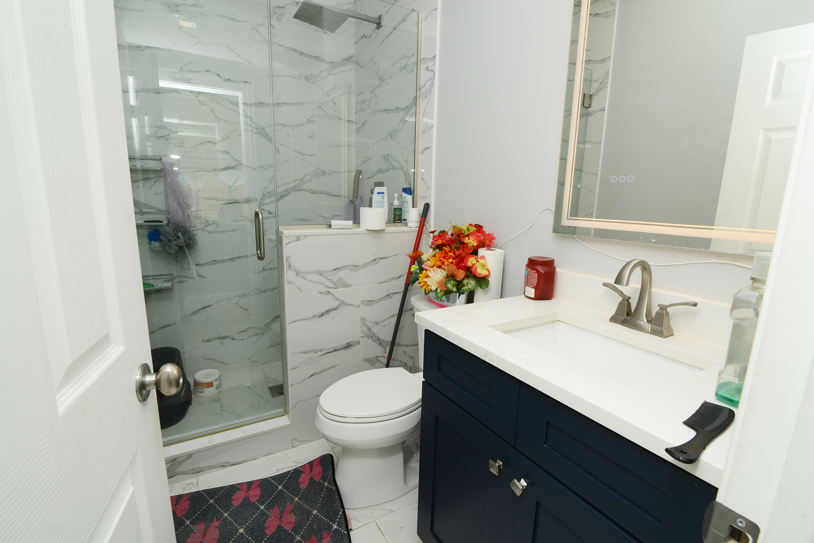 1051 North Springfield Avenue Chicago, IL 60651 - Photo 26 of 50 a bathroom with a sink toilet and shower