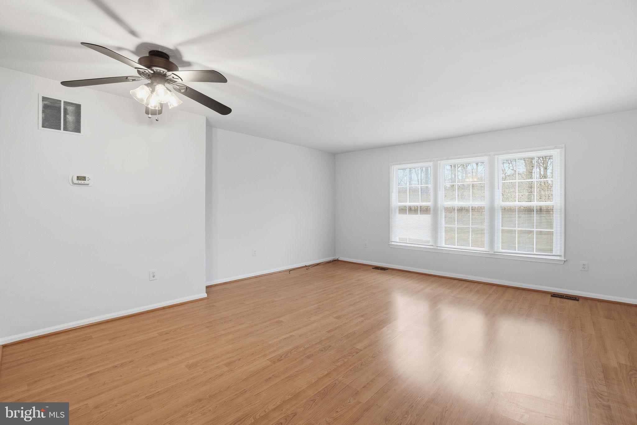 7923 Pebble Brook Court Springfield, VA 22153 - Photo 11 of 34 a view of empty room with wooden floor and fan