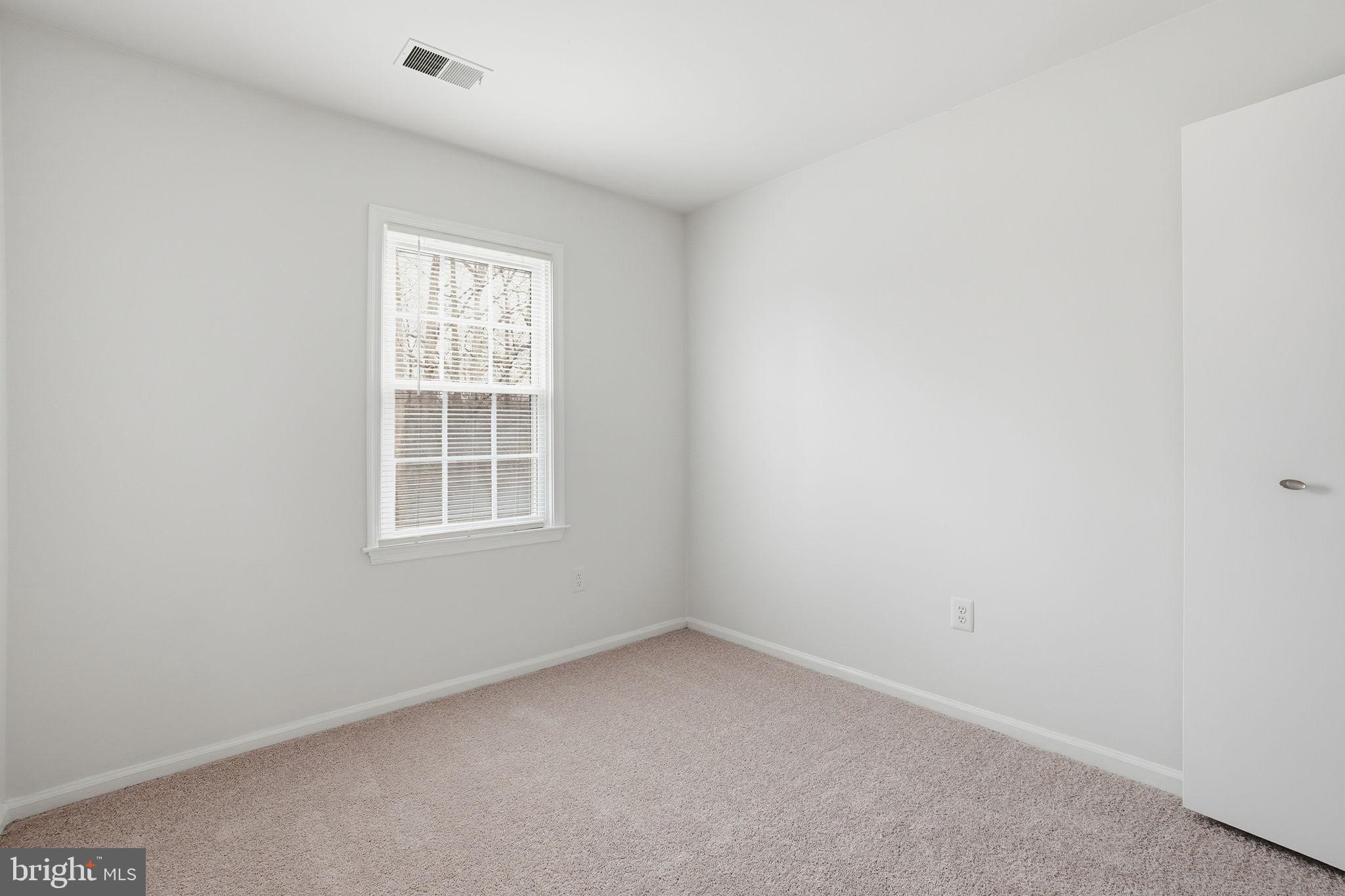 7923 Pebble Brook Court Springfield, VA 22153 - Photo 15 of 34 an empty room with a window