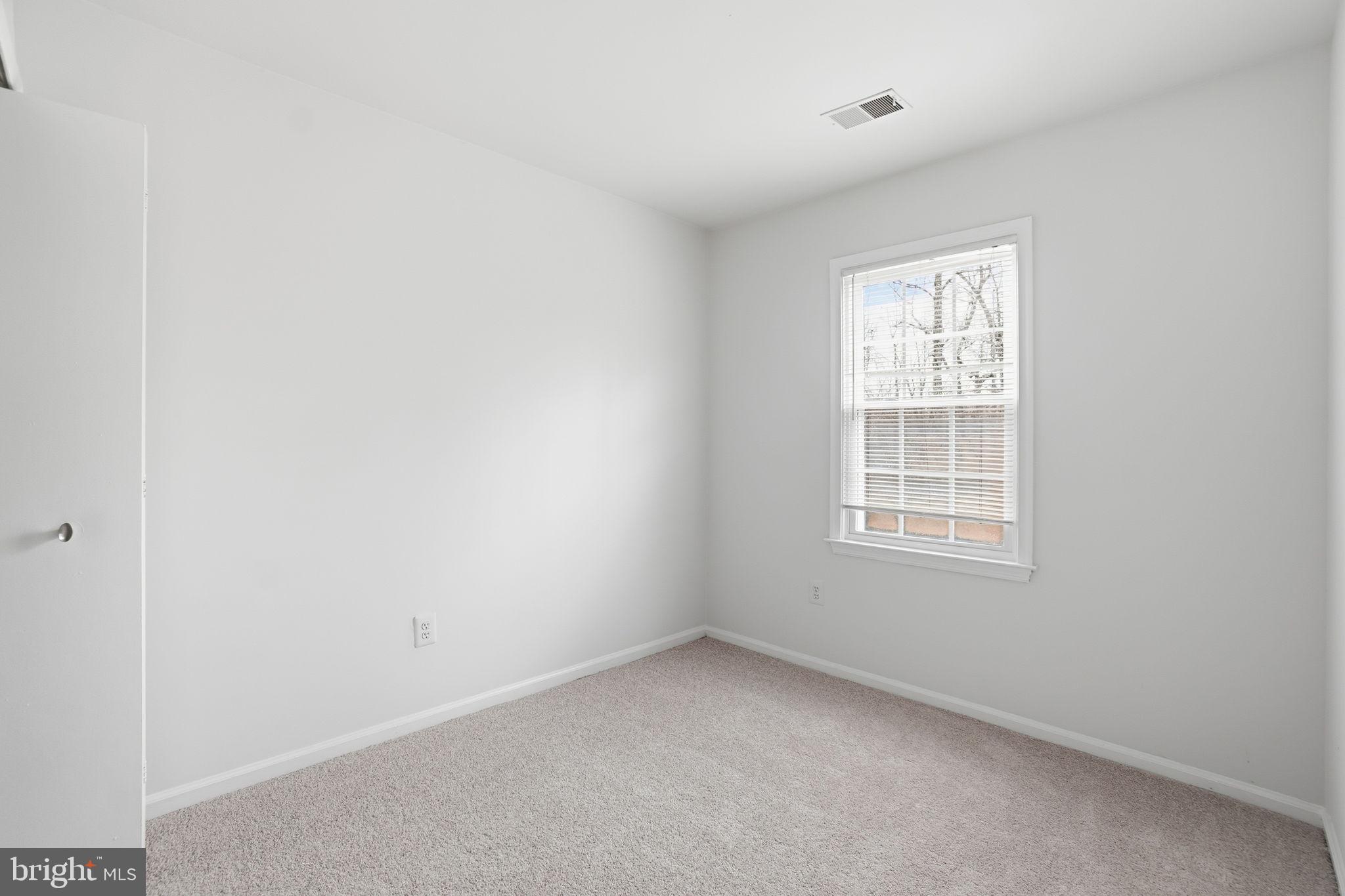 7923 Pebble Brook Court Springfield, VA 22153 - Photo 18 of 34 an empty room with a window