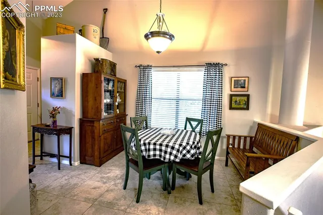 a dining room with furniture and window