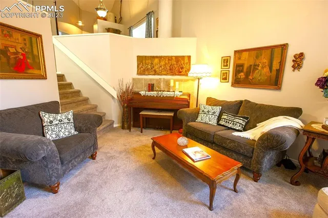 a living room with furniture and a rug
