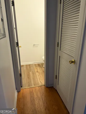 a room with wooden floors and furniture