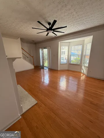 a bathroom with a toilet and a mirror