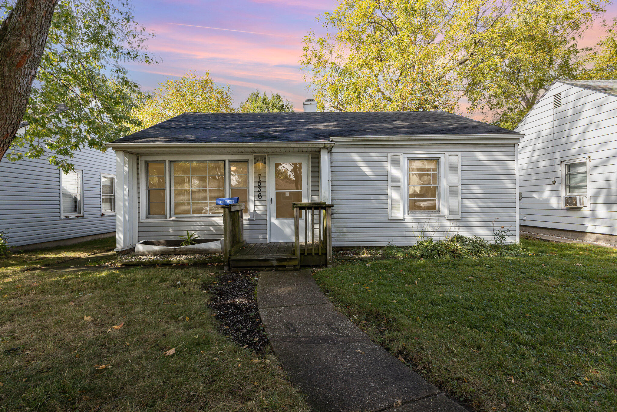 7536 Harrison Avenue Hammond, IN 46324 - Photo 1 of 16 a front view of a house with garden