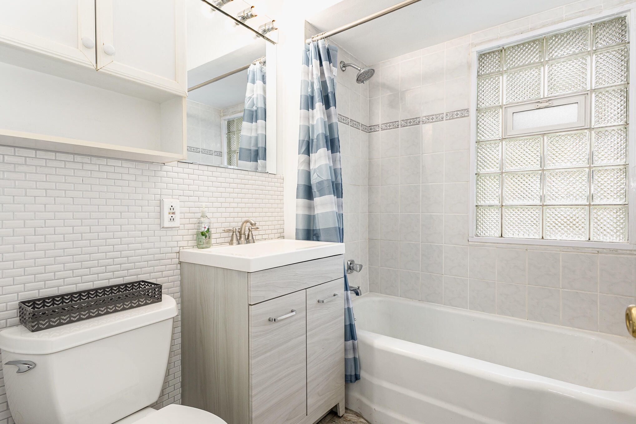 7536 Harrison Avenue Hammond, IN 46324 - Photo 11 of 16 a bathroom with a sink toilet vanity and shower