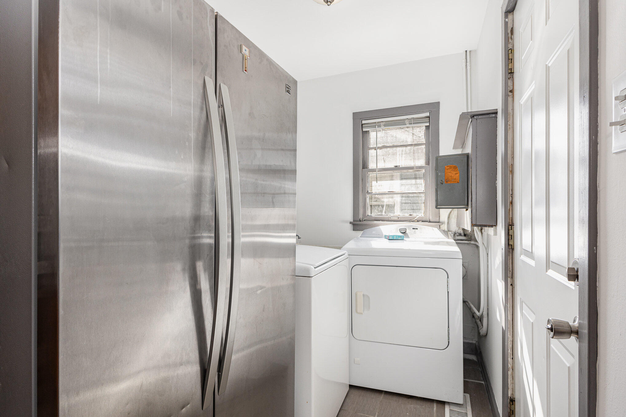 7536 Harrison Avenue Hammond, IN 46324 - Photo 12 of 16 a view of washer and dryer with refrigerator in kitchen