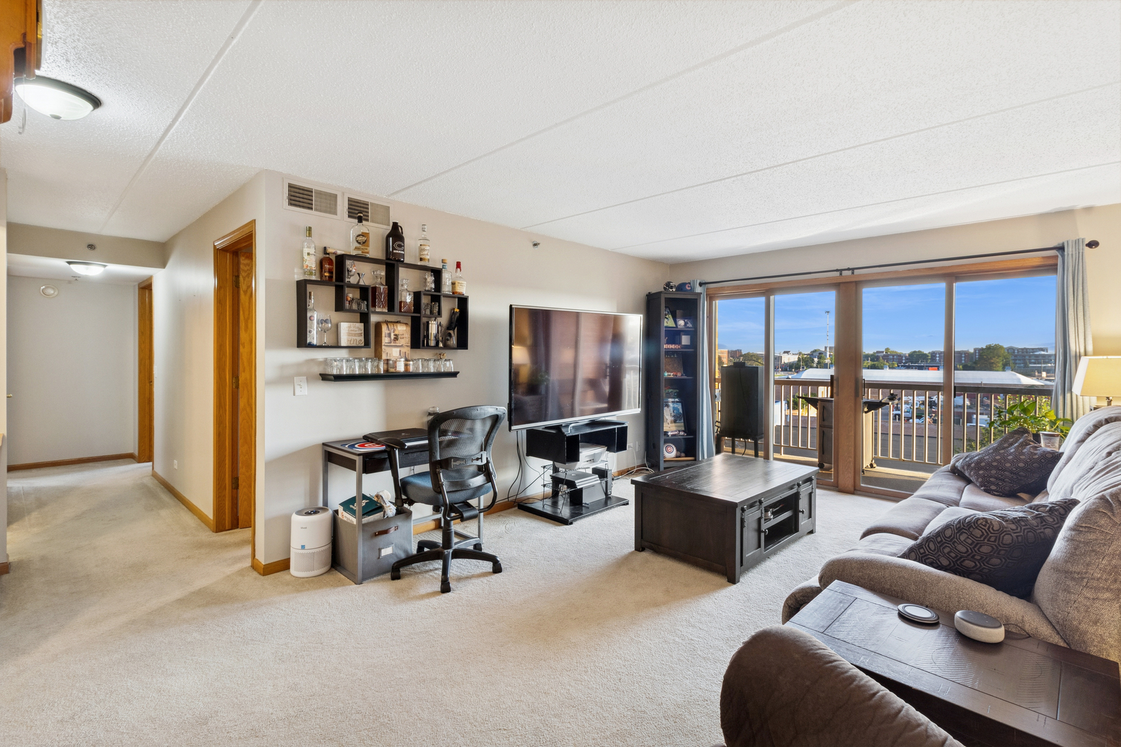 7450 North Waukegan Road, Unit 404 Niles, IL 60714 - Photo 15 of 21 a living room with furniture and floor to ceiling window