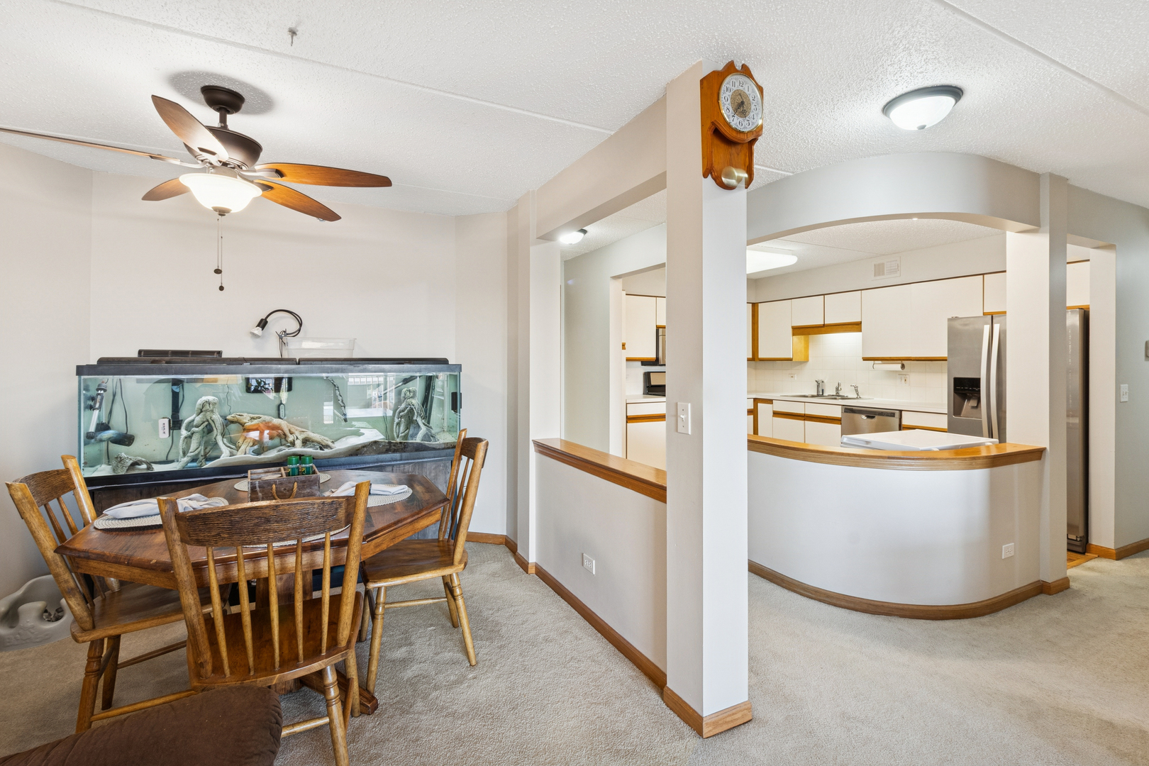 7450 North Waukegan Road, Unit 404 Niles, IL 60714 - Photo 16 of 21 a kitchen with stainless steel appliances granite countertop a sink and a refrigerator