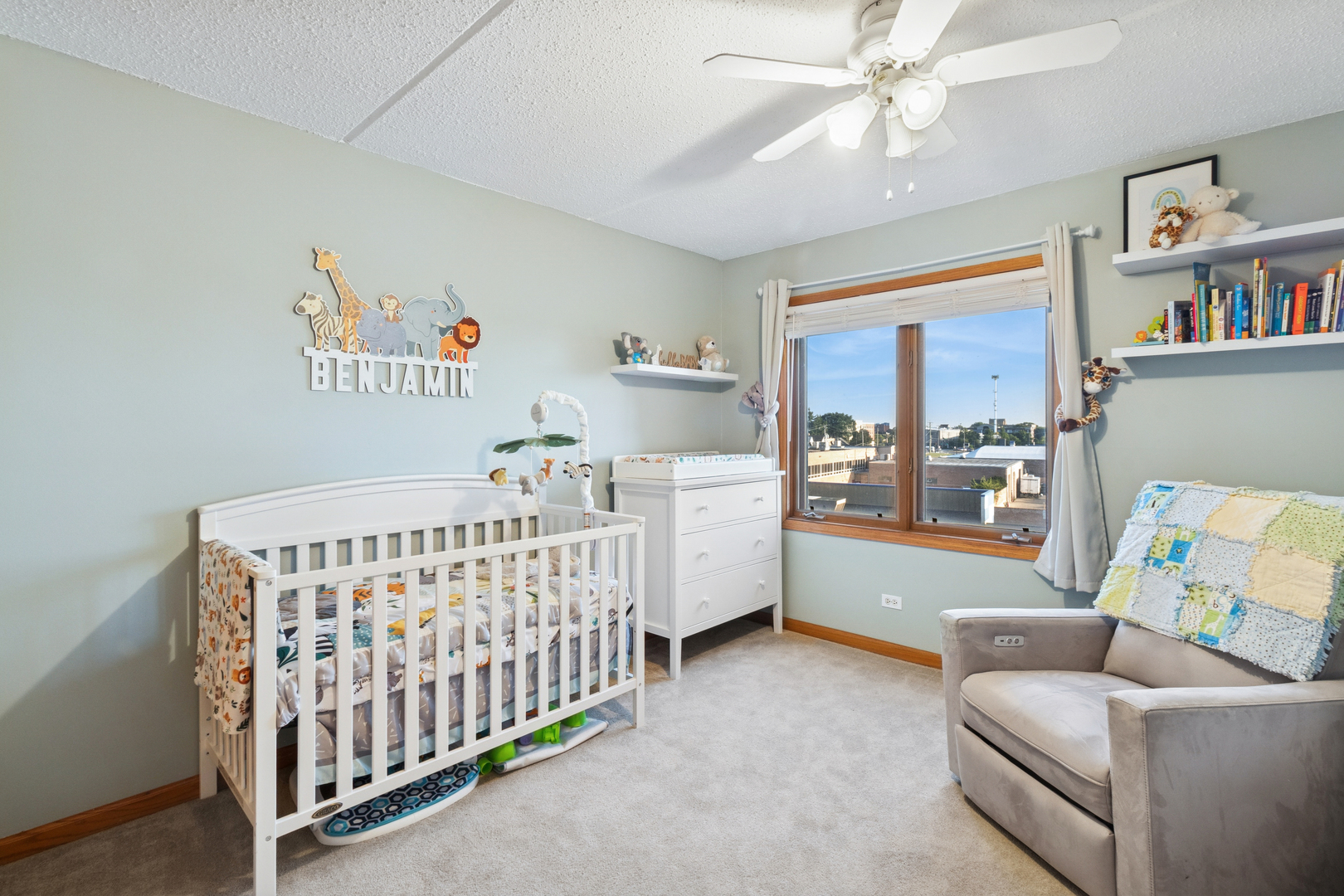 7450 North Waukegan Road, Unit 404 Niles, IL 60714 - Photo 7 of 21 a bedroom with furniture and a baby crib