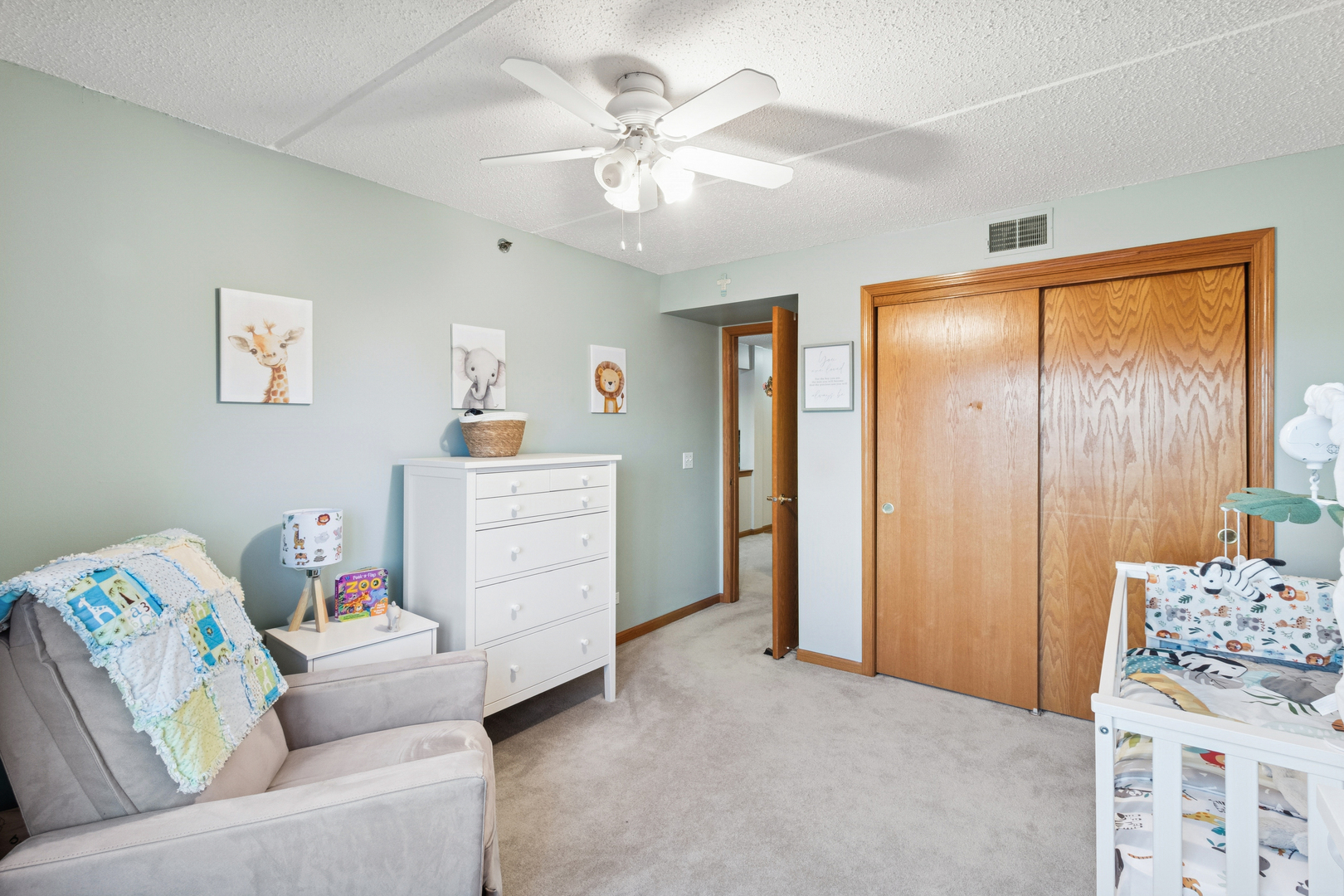 7450 North Waukegan Road, Unit 404 Niles, IL 60714 - Photo 8 of 21 a living room with furniture and a chandelier
