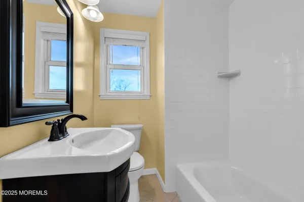 a bathroom with a sink and a bathtub