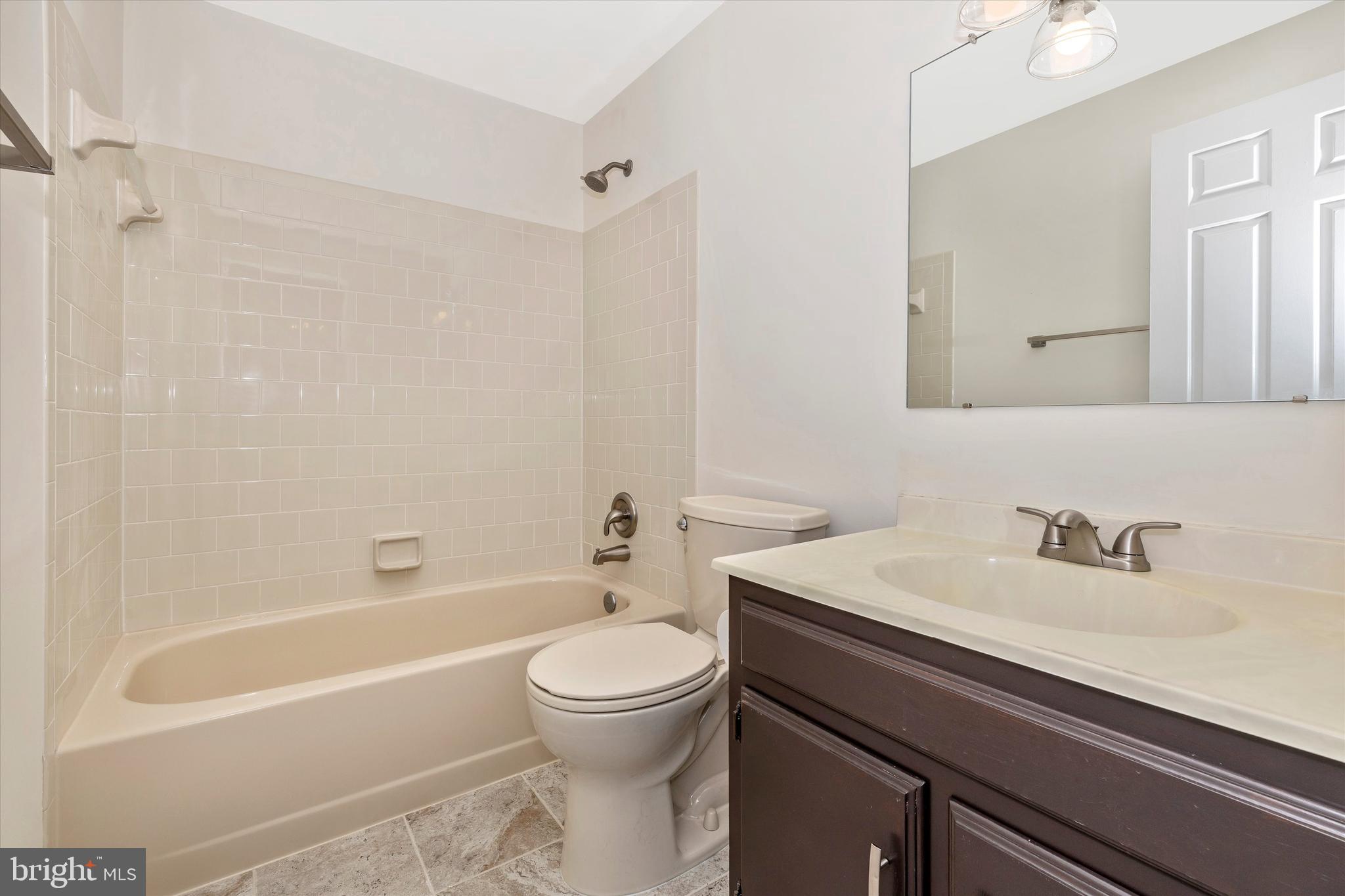 8001 Hollow Reed Court Frederick, MD 21701 - Photo 28 of 33 a bathroom with a sink a toilet and shower