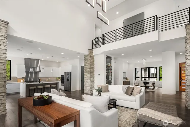a living room with furniture and kitchen view