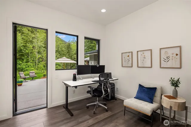 a view of a livingroom with workspace and a couch