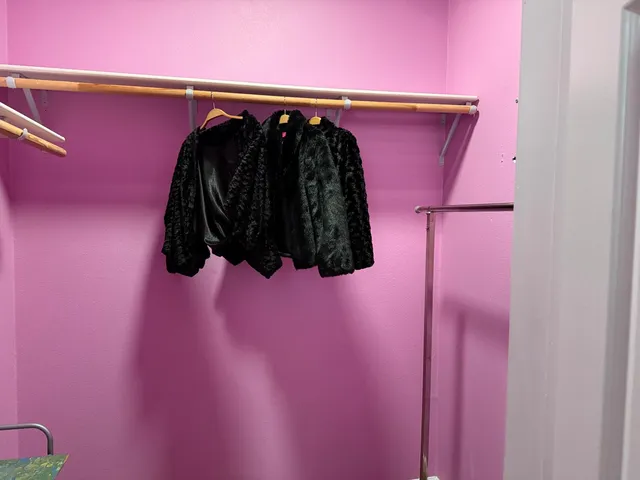 a bathroom with a granite countertop sink a mirror and shower