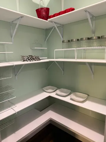 a view of a workspace room with a window