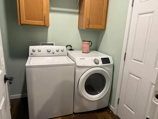 a kitchen with stainless steel appliances granite countertop a refrigerator a sink and a refrigerator