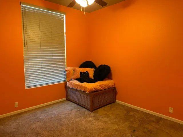 a view of empty room with fan
