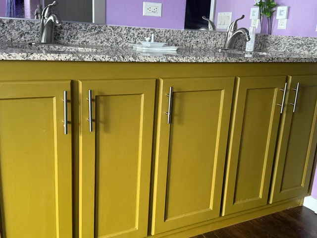 a kitchen with a sink cabinets and window
