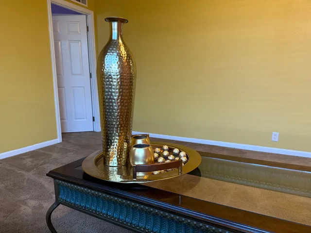 a kitchen with a sink a stove and cabinets