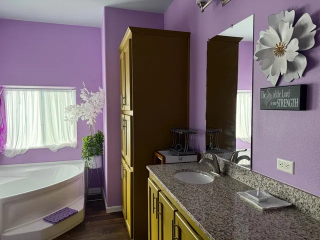 a bathroom with a sink toilet and a mirror