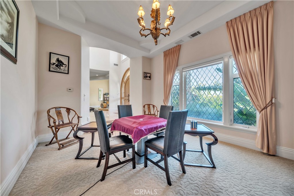 43744 Calle De Velardo Temecula, CA 92592 - Photo 17 of 60 a dining room with furniture and window