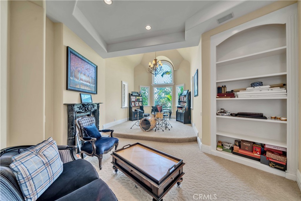 43744 Calle De Velardo Temecula, CA 92592 - Photo 20 of 60 a living room with furniture a flat screen tv and a window
